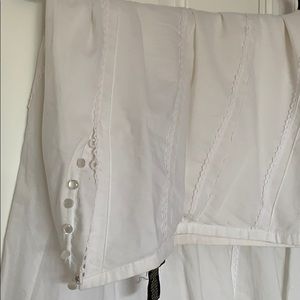 Brand New with no tags. Runs very small. Size 0